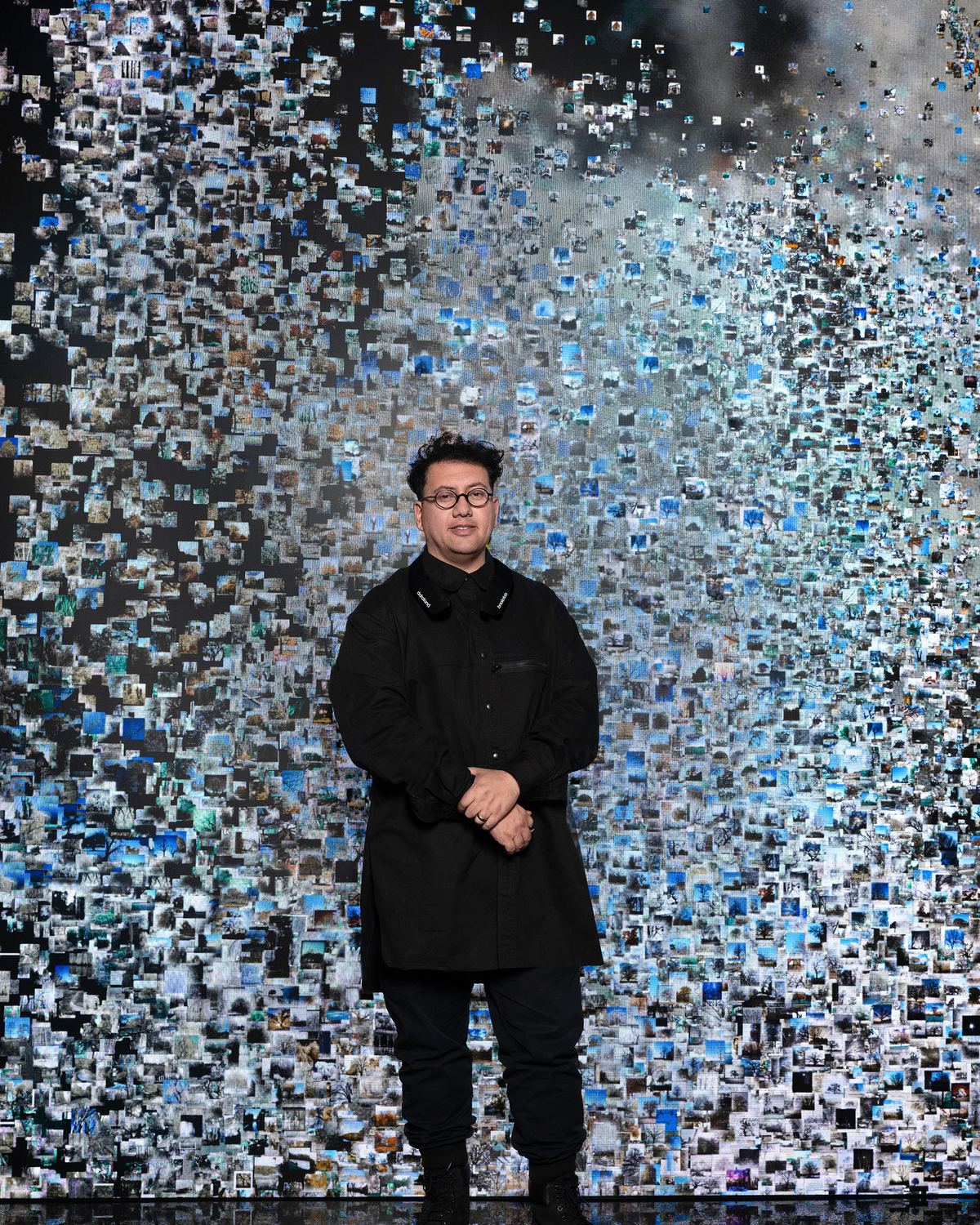 Portrait before the archival mosaic wall at DATALAND